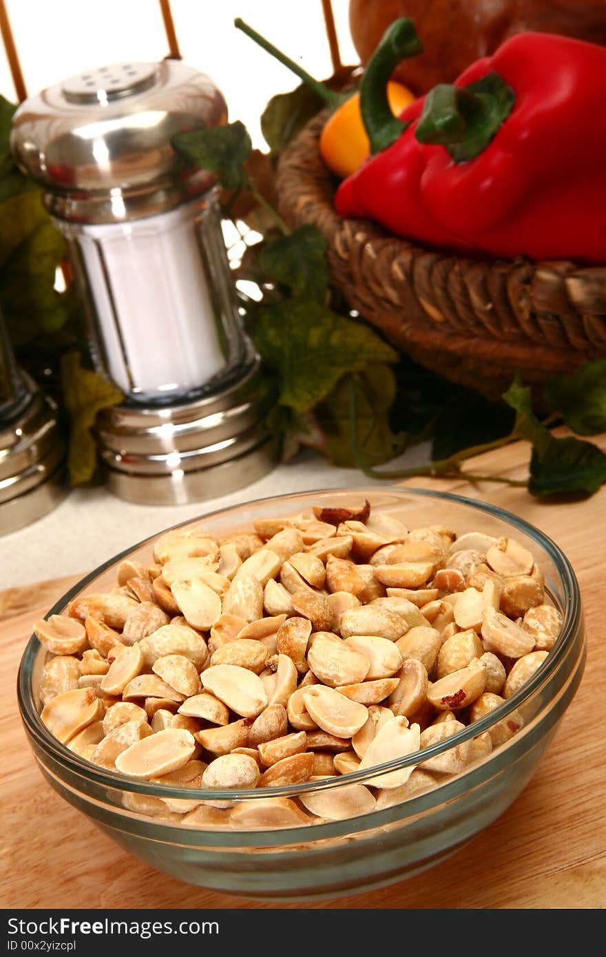 Unsalted dry roasted peanuts in a bowl in kitchen or restaurant. Unsalted dry roasted peanuts in a bowl in kitchen or restaurant.