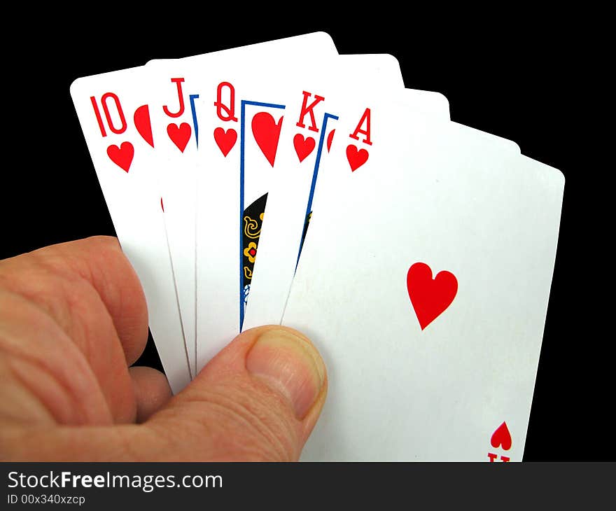 Person holding the royal flush in hearts