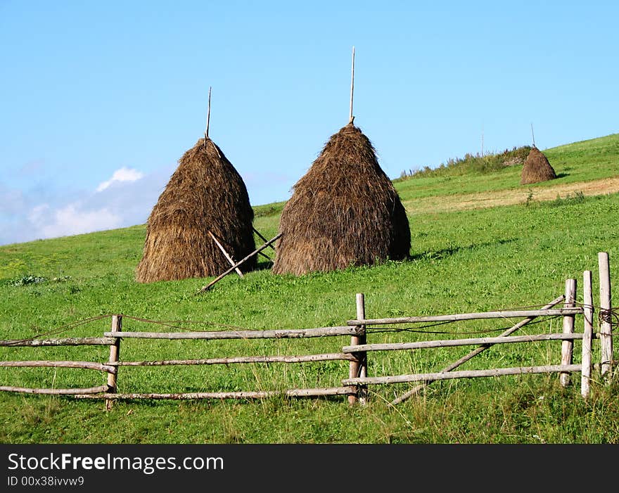 Stacks of hay in mountain village. Carpathians, Ukraine