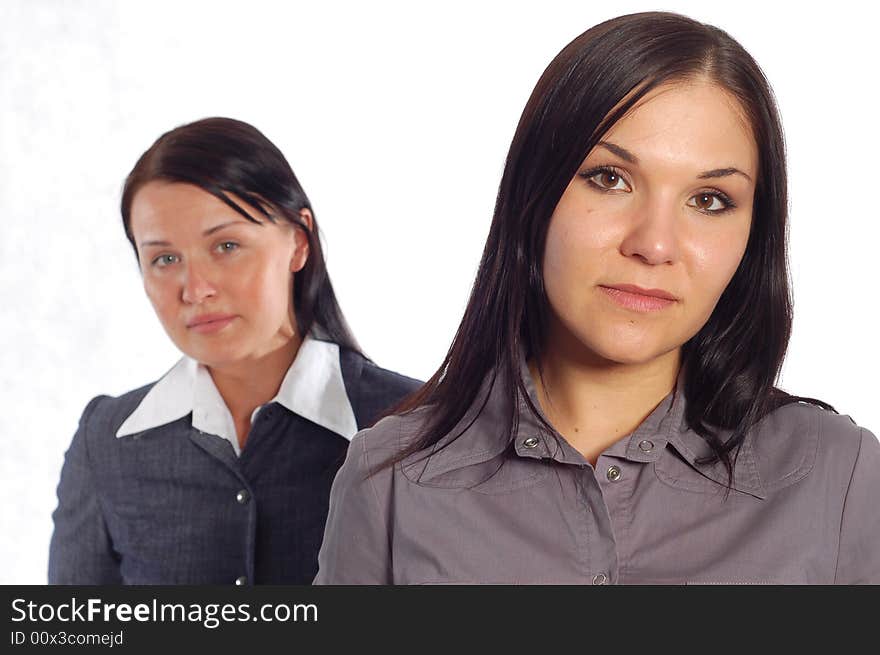 Two attractive businesswomen on white background. Two attractive businesswomen on white background