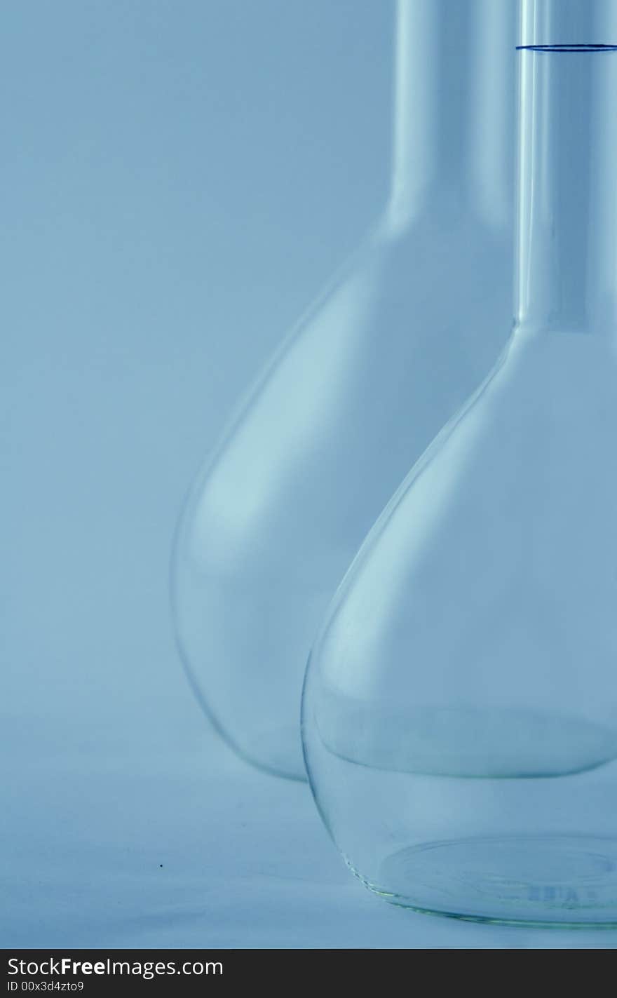 Laboratory flask in a blue environment. Laboratory flask in a blue environment.