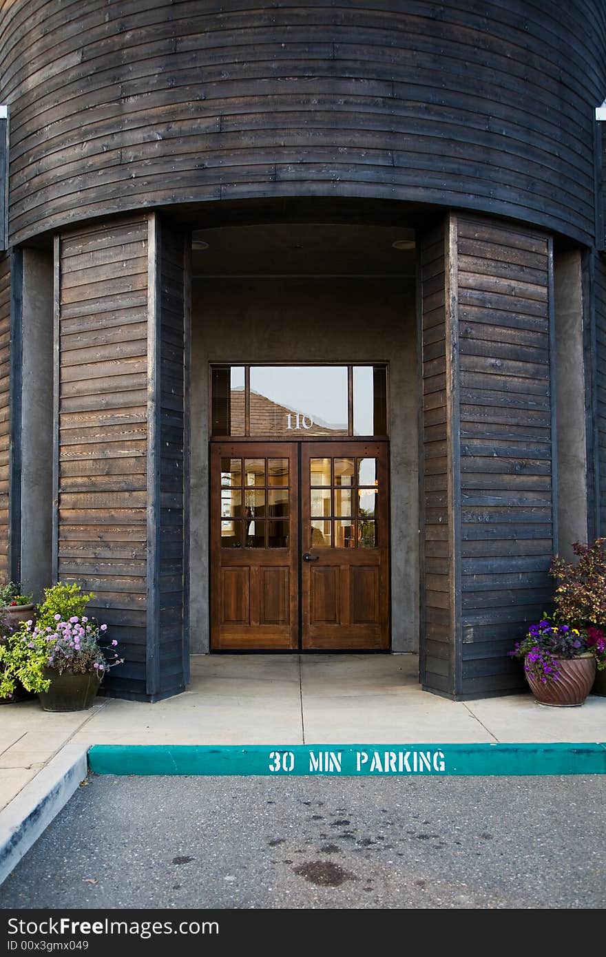 Entrance to building with a pair of wooden doors