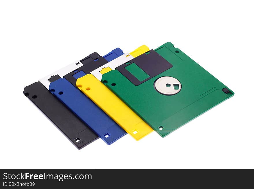 The hand holds some multi-coloured diskettes on a white background