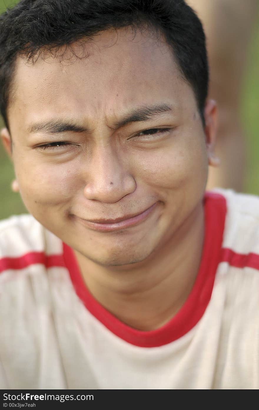 Asian Man making a funny weird face. Asian Man making a funny weird face