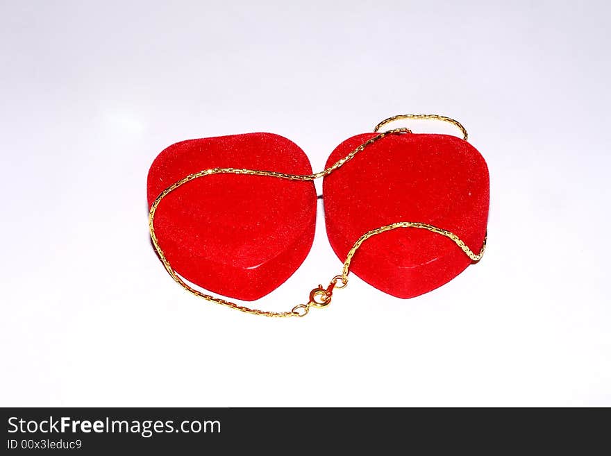 Jewelry chain in red case on white background