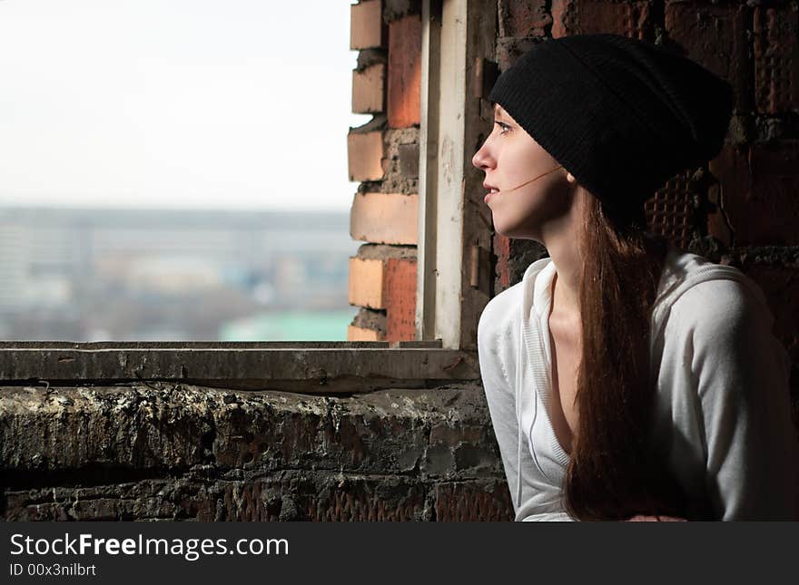 Portrait of girl in ruined basement near window. Portrait of girl in ruined basement near window