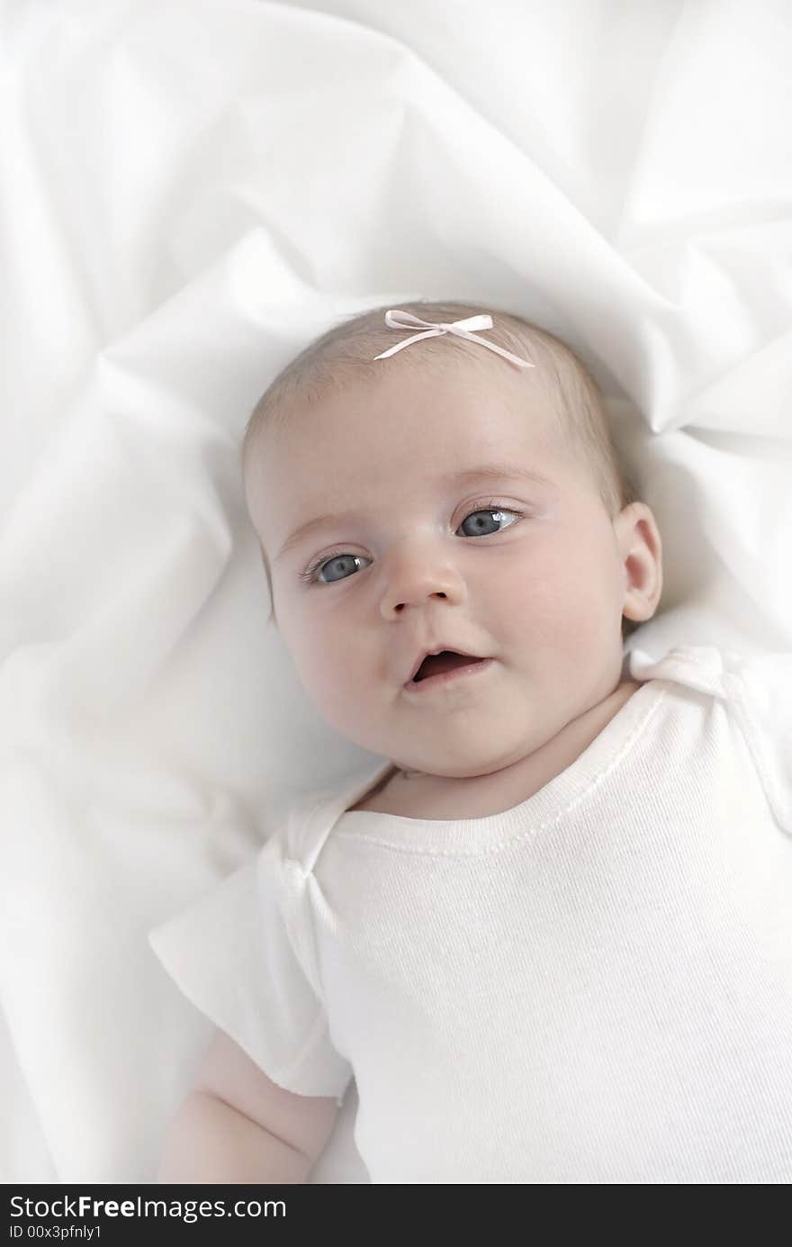 Baby on White Blanket