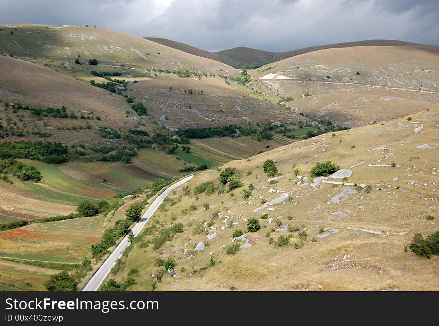 A mountain landscape with cloudy sky