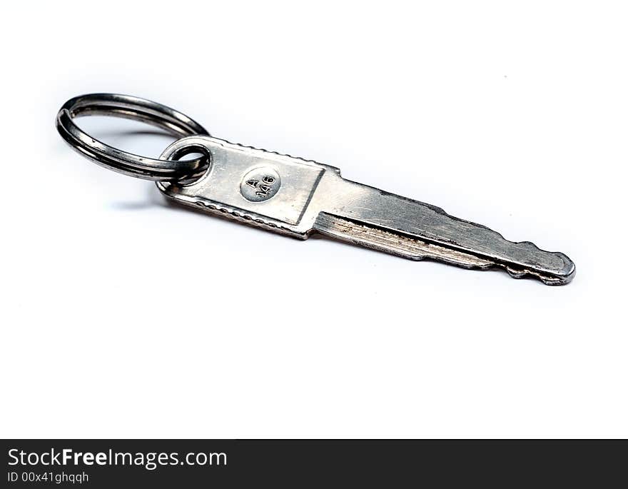 Old key over white background