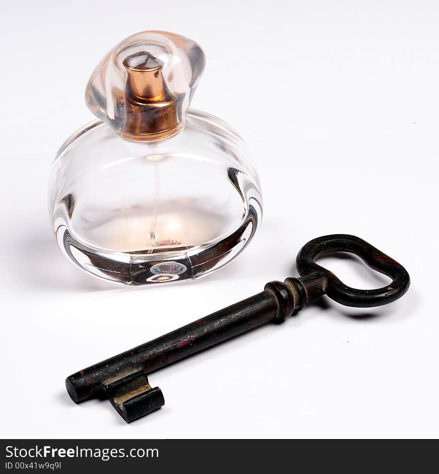 Old key and perfume bottle