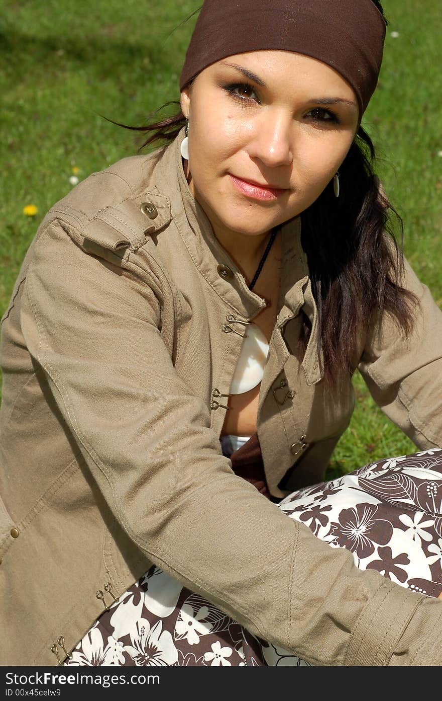 Attractive woman relaxing on green grass. Attractive woman relaxing on green grass