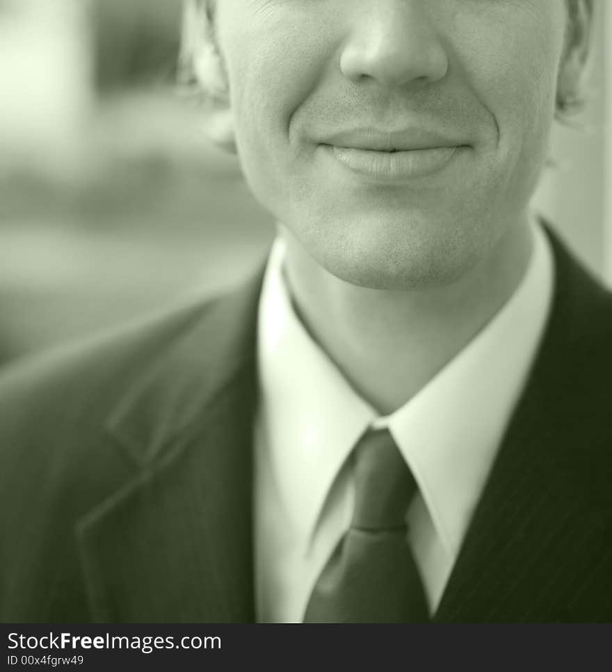 Mouth of handsome young businessman with suit and tie