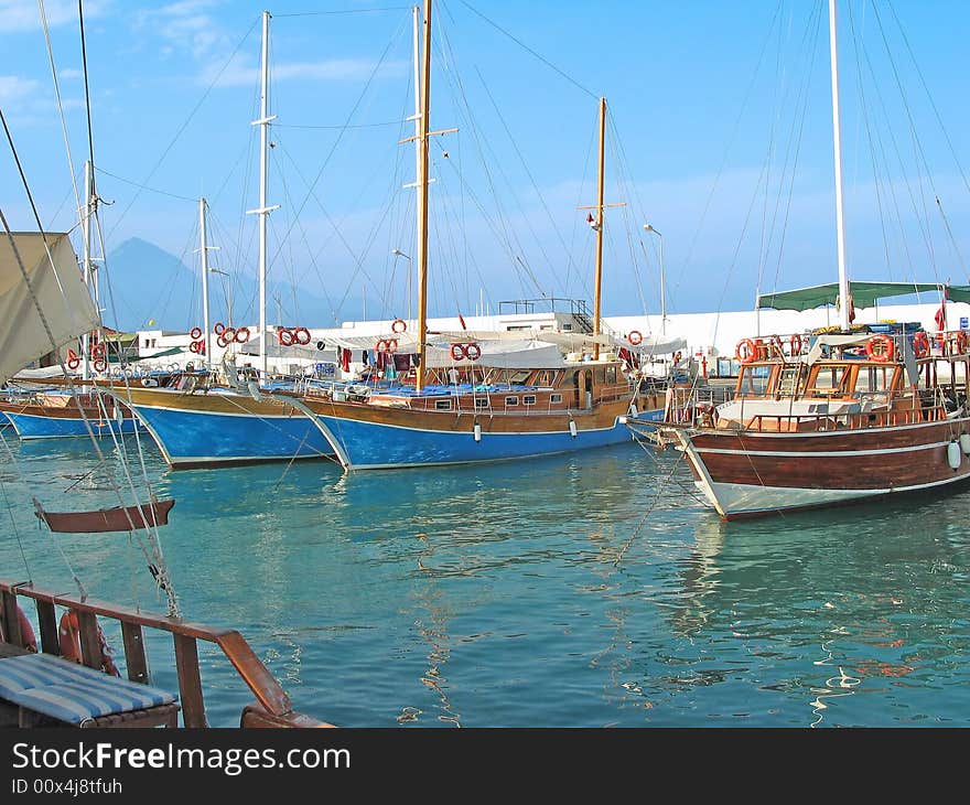 Some sailboats in the dock