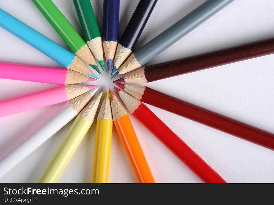 Colorful pencils over white background