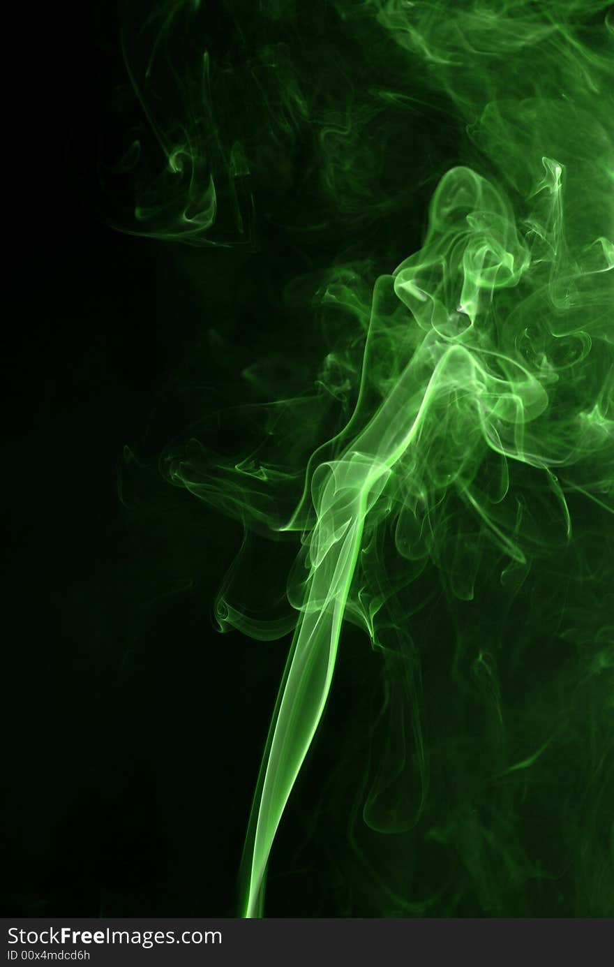 Green smoke texture at black background. Green smoke texture at black background