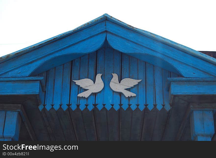 Part of façade of the old humble wooden house in Russia