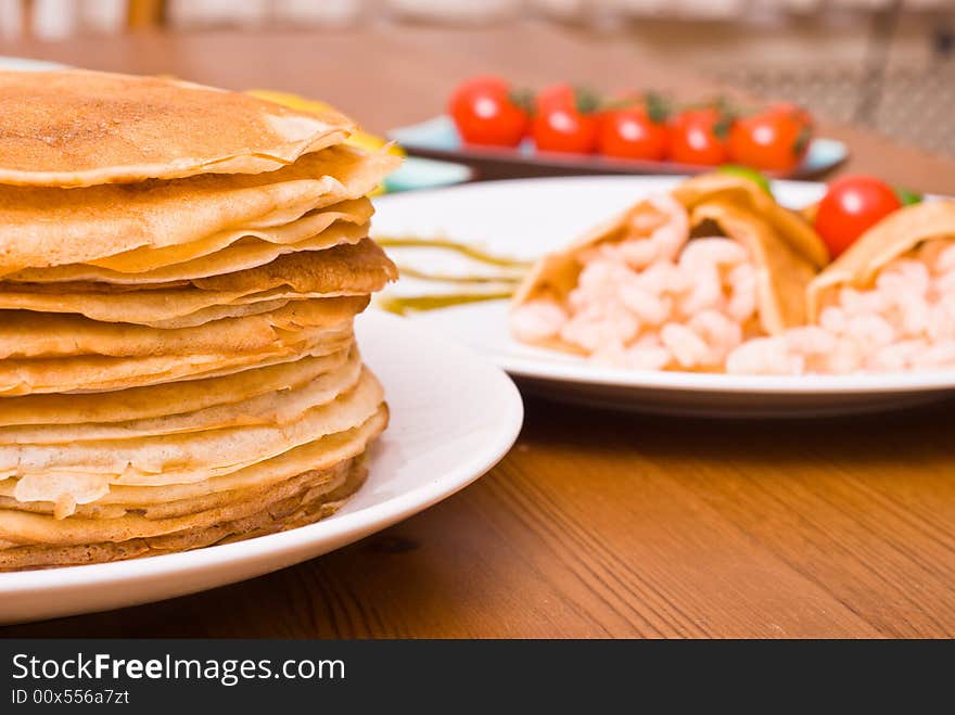 Table served with pancakes, shrimps, Brussels sprouts. Table served with pancakes, shrimps, Brussels sprouts