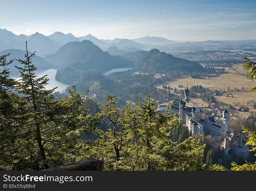 Famous castle Neuschwanstein. Bavaria, Germany. Birds-eye view from a mountain.