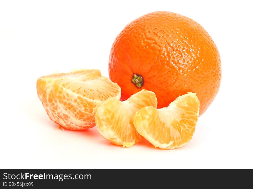 Whole tangerine and segments of a tangerine. Whole tangerine and segments of a tangerine