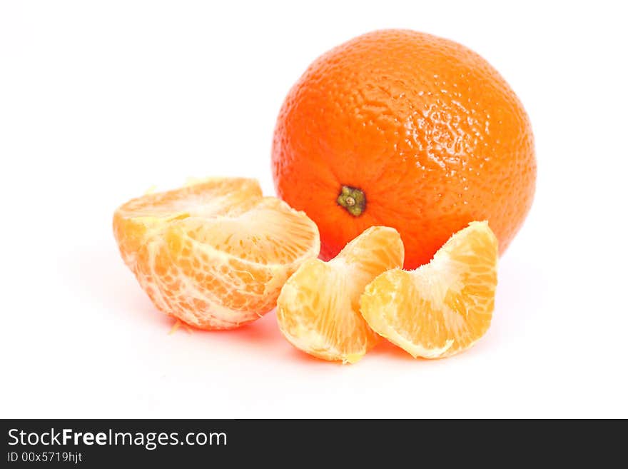 Whole tangerine and segments of a tangerine. Whole tangerine and segments of a tangerine