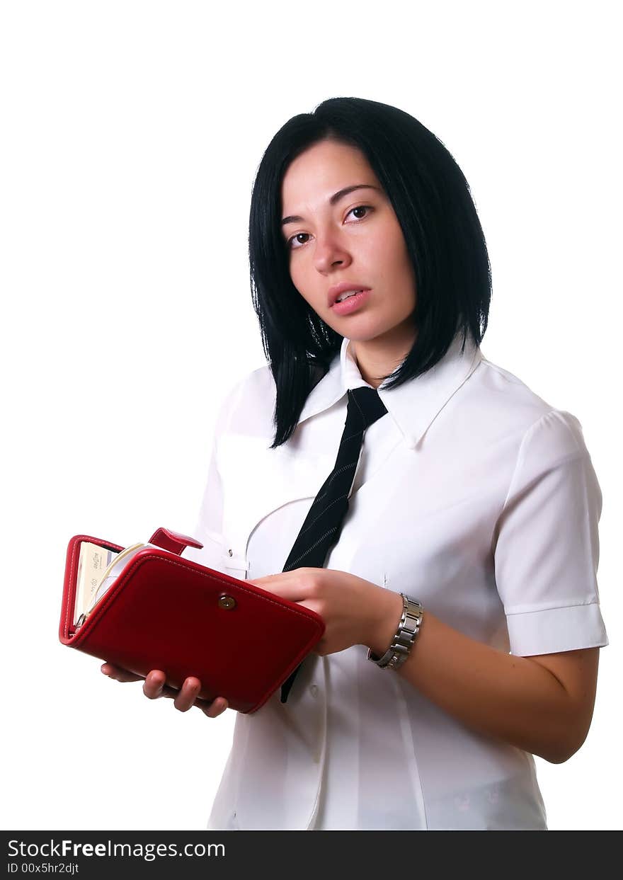 A portrait about a young attractive businesswoman with black hair who is holding a red calendar, she is thinking about her schedule and she is wearing a white shirt and a black tie. A portrait about a young attractive businesswoman with black hair who is holding a red calendar, she is thinking about her schedule and she is wearing a white shirt and a black tie