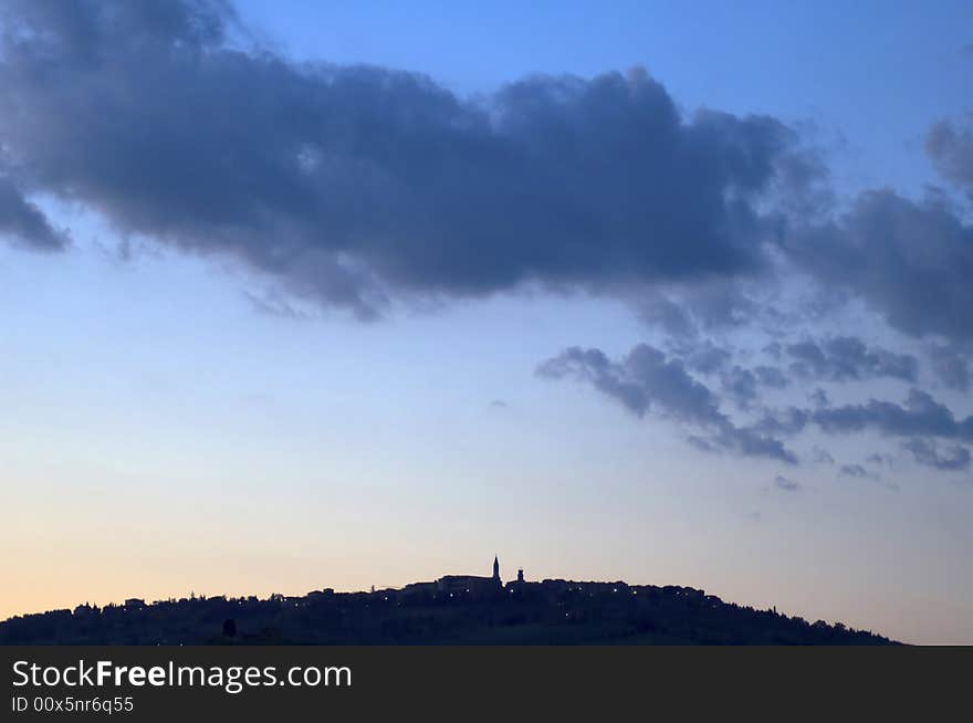 Night falls on Pienza, Italy.