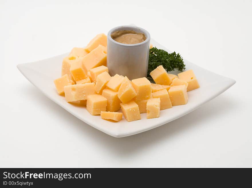 Cheese snack with mustard on a plate