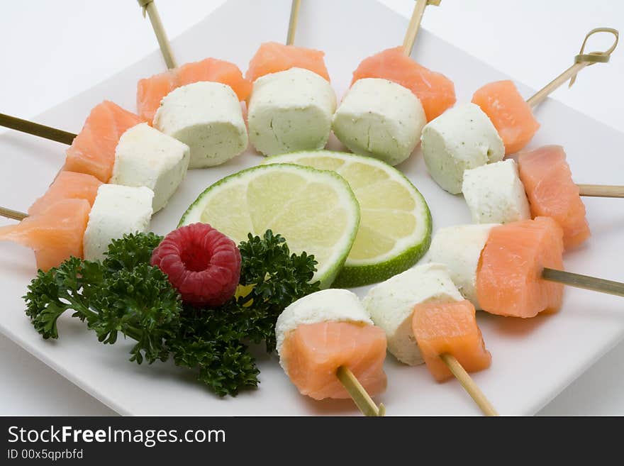 Appetizer with smoked salmon and cheese on a plate