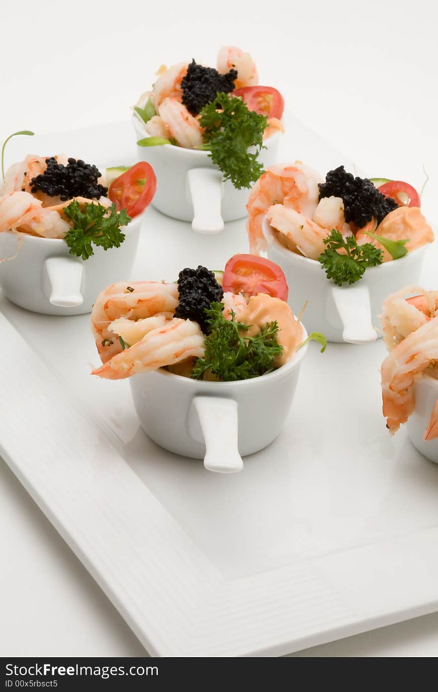 Prawn appetizer with caviar in little bowls