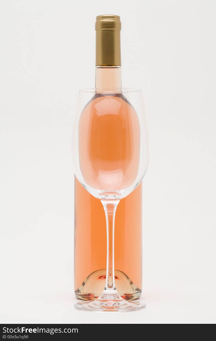 Rose Wine Bottle With Empty Glass