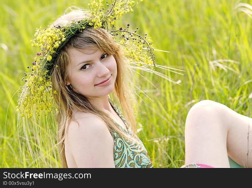 Vivid picture of nice young lady relaxing at summer meadow. Vivid picture of nice young lady relaxing at summer meadow