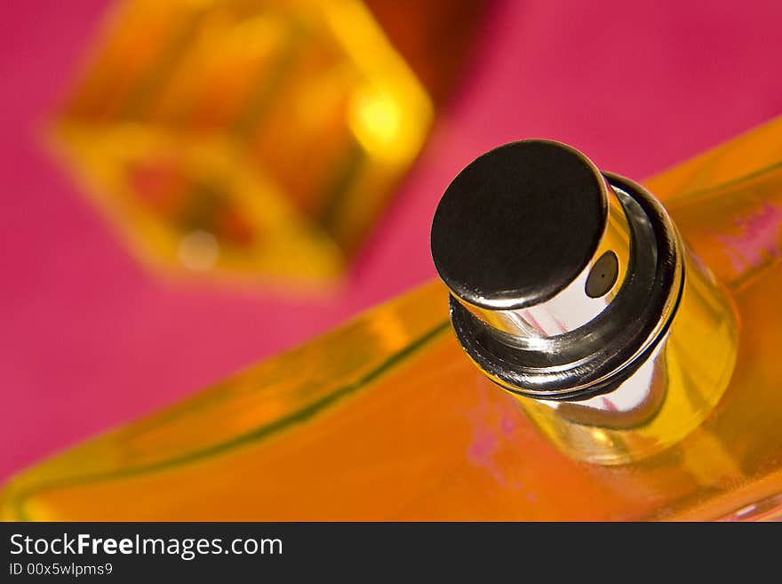 Yellow bottle with a sprayer on a red background