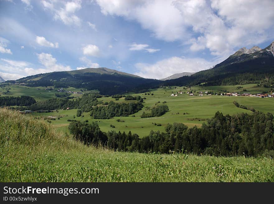 Mountain rural landscape, village in green slopes, Alps, Switzerland. Mountain rural landscape, village in green slopes, Alps, Switzerland.