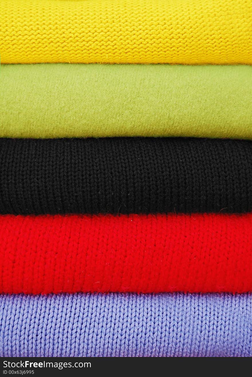 Colored textile clothes set in the vertical stack