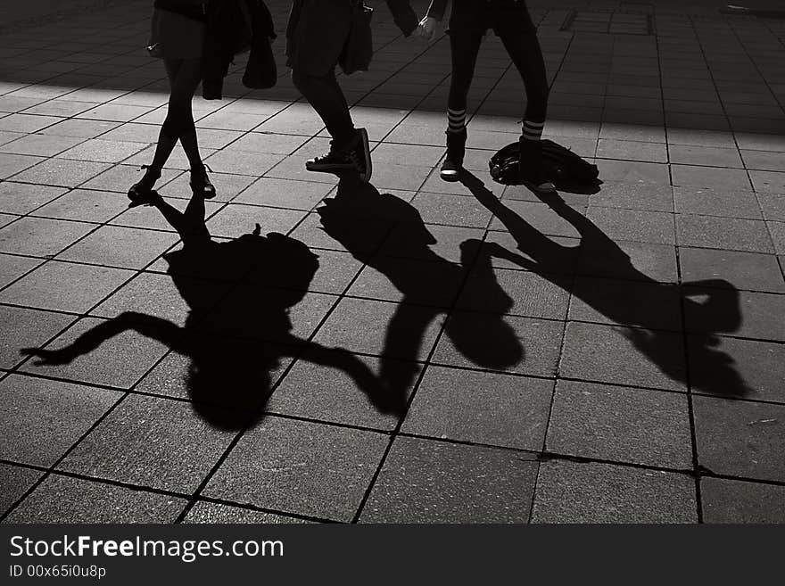 Shadow of 3 crazy young women masqueraded as witches. Shadow of 3 crazy young women masqueraded as witches