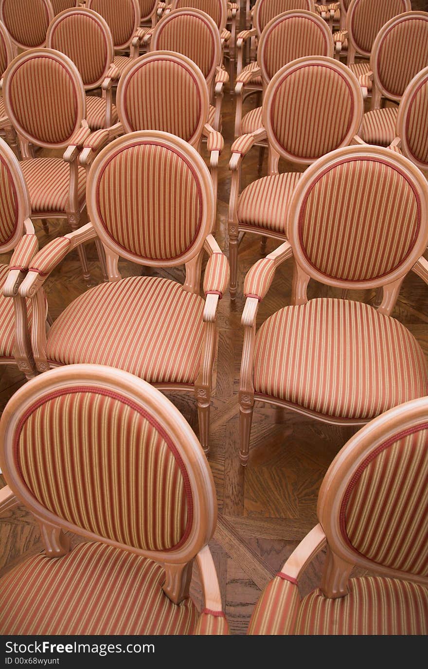 Old style chairs in an auditorium of a historic castle's music hall. Old style chairs in an auditorium of a historic castle's music hall...