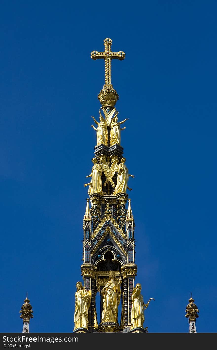 Christian golden cross in the top of the Albert Memorial, London.