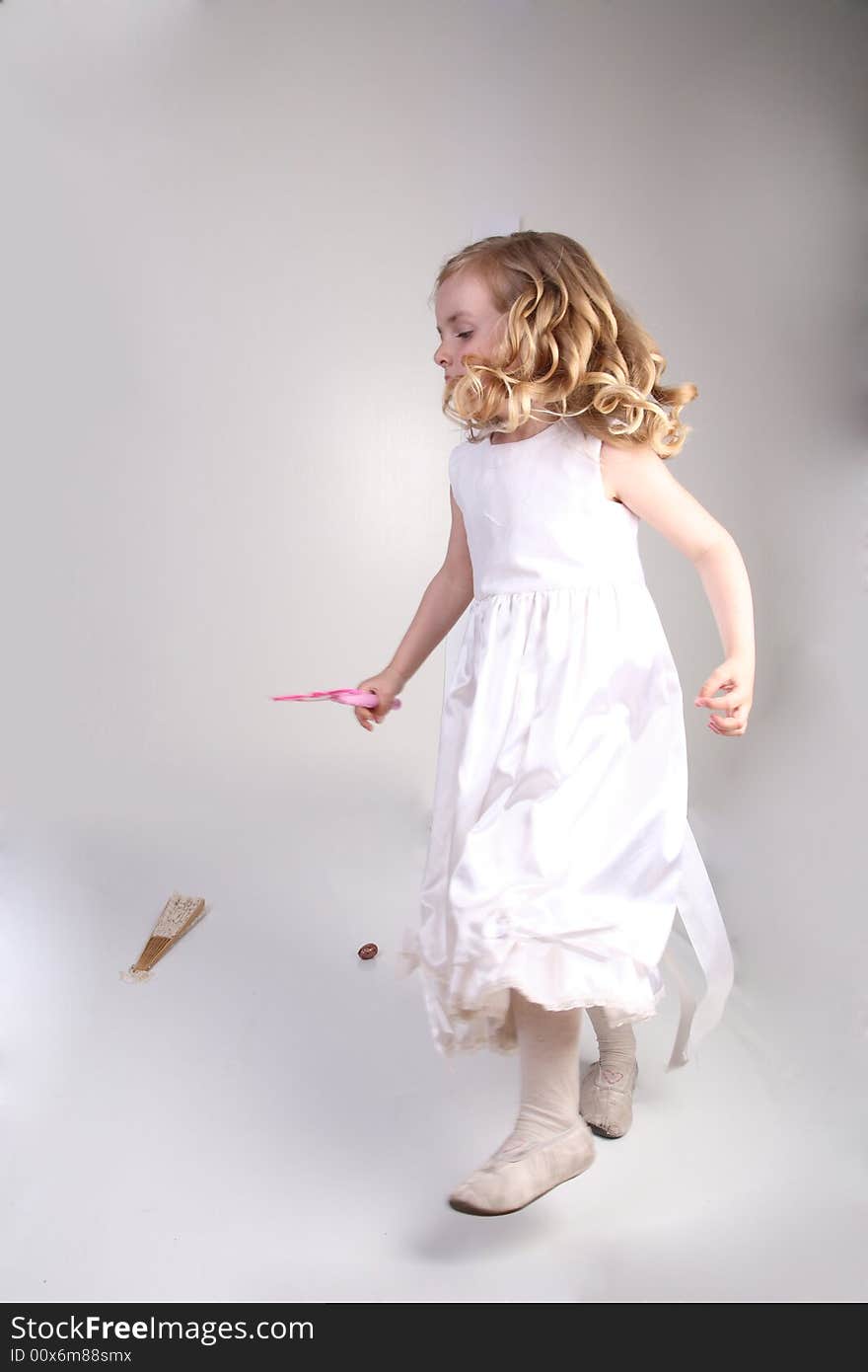 Little girl with curl hair  jumping over gray. Little girl with curl hair  jumping over gray