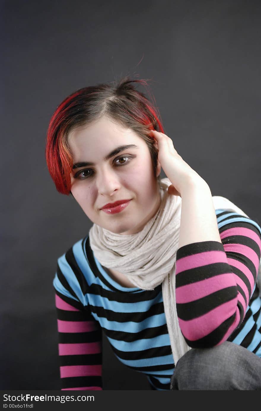 Young female model pose for portrait in a studio. Young female model pose for portrait in a studio