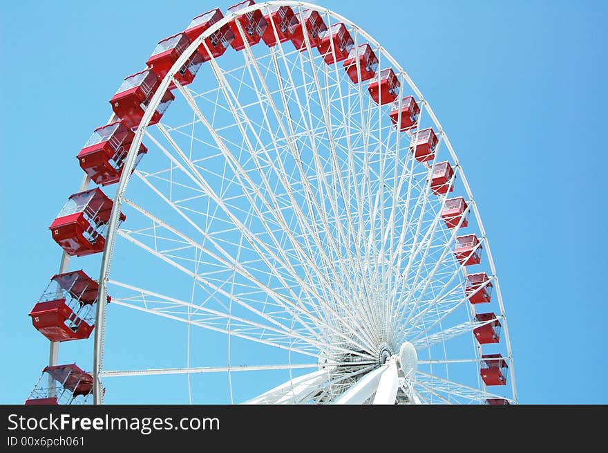 A huge red and white ferris wheel