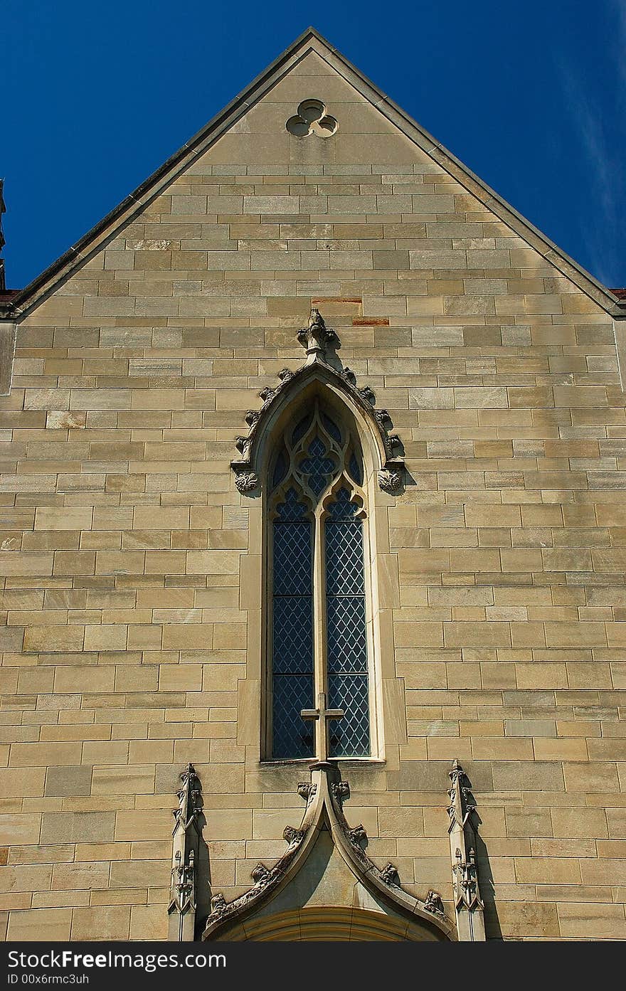 This picture was taken at a church in Indianapolis. Gothic architecture is a style of architecture which flourished during the high and late medieval period. It evolved from Romanesque architecture and was succeeded by Renaissance architecture. Originating in 12th-century France and lasting into the 16th century, Gothic architecture was known during the period as the French Style (Opus Francigenum), with the term Gothic first appearing during the latter part of the Renaissance as a stylistic insult. Its characteristic features include the pointed arch, the ribbed vault and the flying buttress. Gothic architecture is most familiar as the architecture of many of the great cathedrals, abbeys and parish churches of Europe. It is also the architecture of many castles, palaces, town halls, guild halls, universities, and to a less prominent extent, private dwellings. It is in the great churches and cathedrals and in a number of civic buildings that the Gothic style was expressed most powerfully, its characteristics lending themselves to appeal to the emotions. A great number of ecclesiastical buildings remain from this period, of which even the smallest are often structures of architectural distinction while many of the larger churches are considered priceless works of art and are listed with UNESCO as World Heritage Sites. For this reason a study of Gothic architecture is largely a study of cathedrals and churches. This picture was taken at a church in Indianapolis. Gothic architecture is a style of architecture which flourished during the high and late medieval period. It evolved from Romanesque architecture and was succeeded by Renaissance architecture. Originating in 12th-century France and lasting into the 16th century, Gothic architecture was known during the period as the French Style (Opus Francigenum), with the term Gothic first appearing during the latter part of the Renaissance as a stylistic insult. Its characteristic features include the pointed arch, the ribbed vault and the flying buttress. Gothic architecture is most familiar as the architecture of many of the great cathedrals, abbeys and parish churches of Europe. It is also the architecture of many castles, palaces, town halls, guild halls, universities, and to a less prominent extent, private dwellings. It is in the great churches and cathedrals and in a number of civic buildings that the Gothic style was expressed most powerfully, its characteristics lending themselves to appeal to the emotions. A great number of ecclesiastical buildings remain from this period, of which even the smallest are often structures of architectural distinction while many of the larger churches are considered priceless works of art and are listed with UNESCO as World Heritage Sites. For this reason a study of Gothic architecture is largely a study of cathedrals and churches.