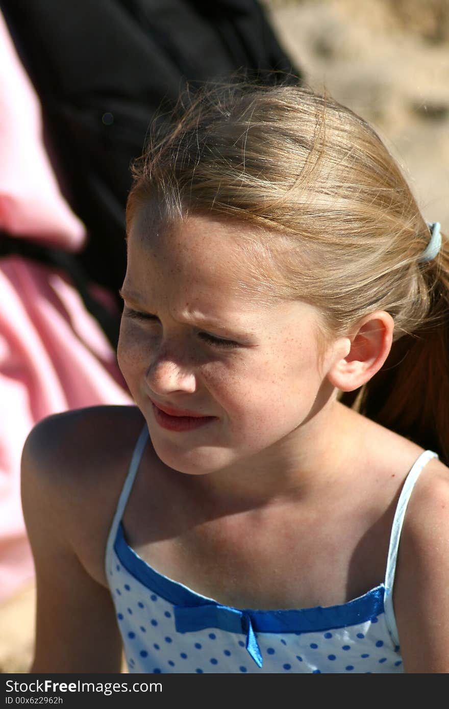 A white caucasian girl child crying with a sad expression on her face. A white caucasian girl child crying with a sad expression on her face