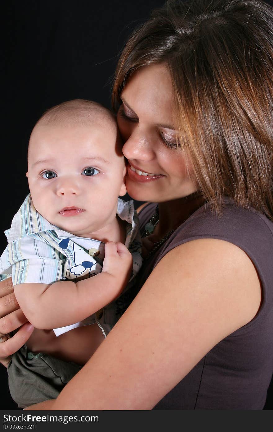 Mother and Baby boy on a black background. Mother and Baby boy on a black background