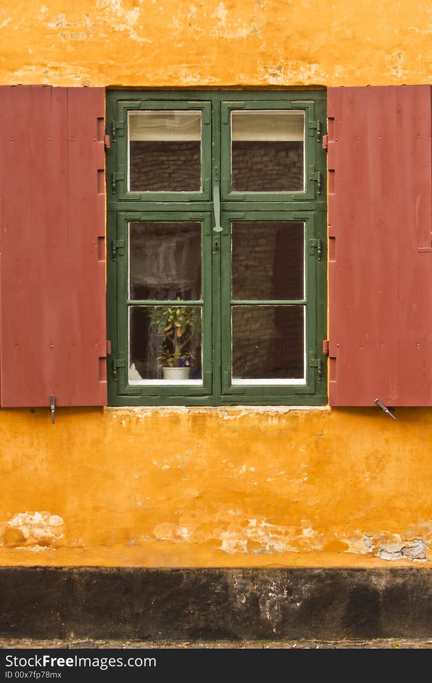 Window of a colorful rustic cottage. Window of a colorful rustic cottage