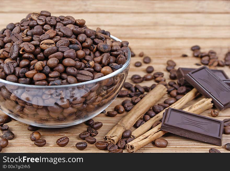 Coffee beans, cinnamon sticks and chocolate. Coffee beans, cinnamon sticks and chocolate