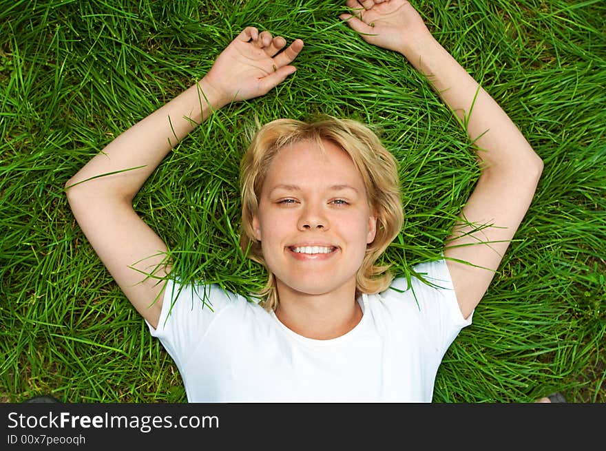 Beauty woman lie green grass. Beauty woman lie green grass