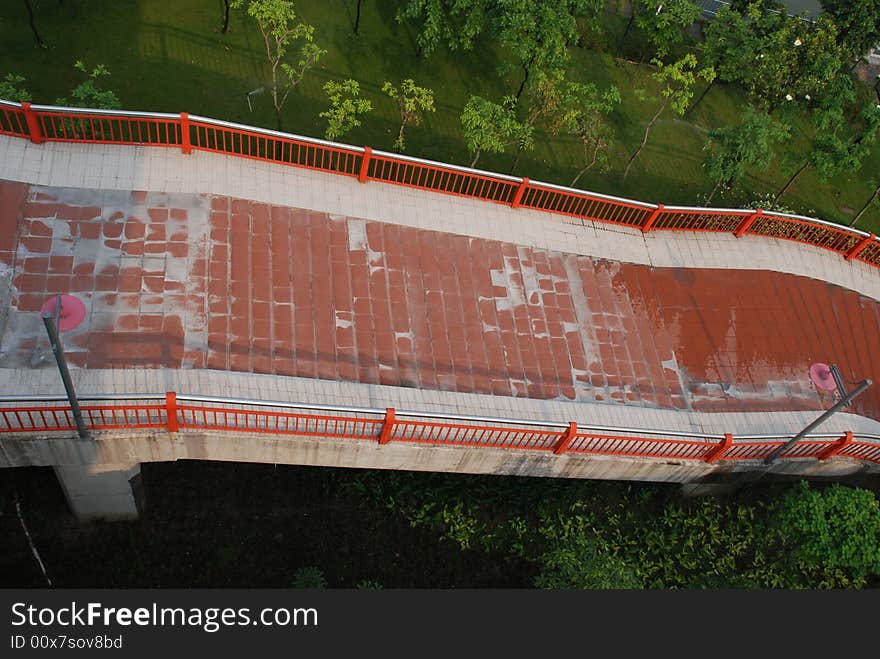 The upward footpath bridge attached to a big modern bridge.