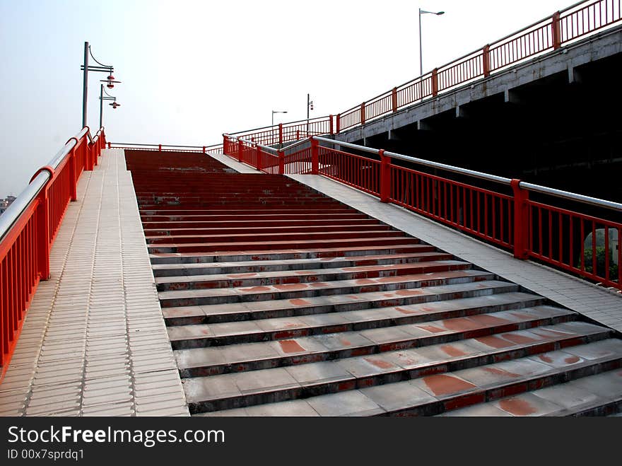 The upward steps of a foot bridge.