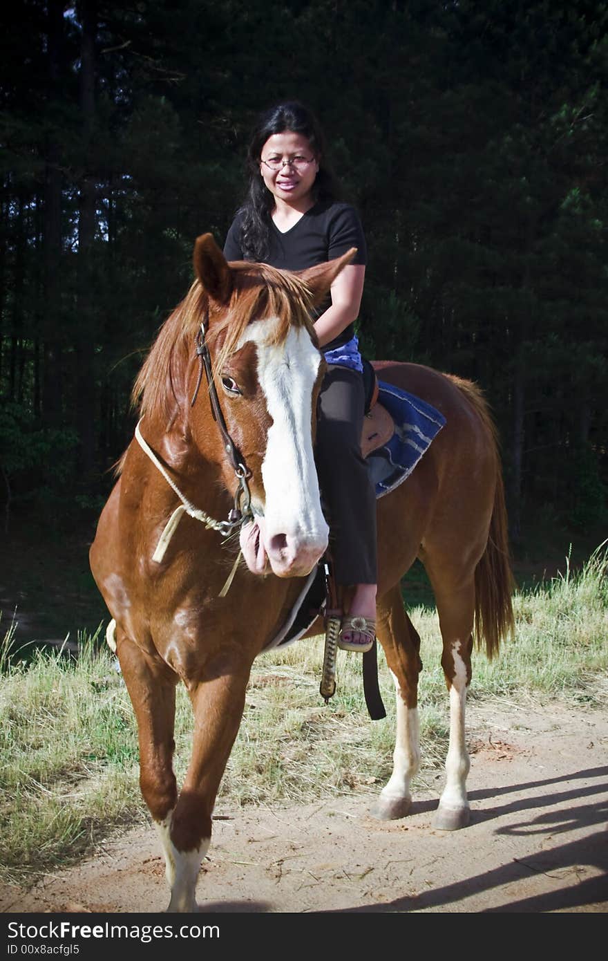 Girl riding horse