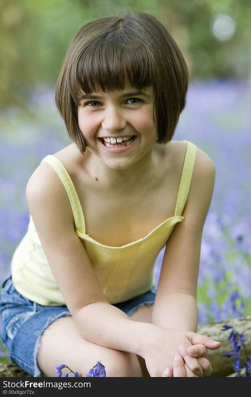 Girl Sitting In Bluebells